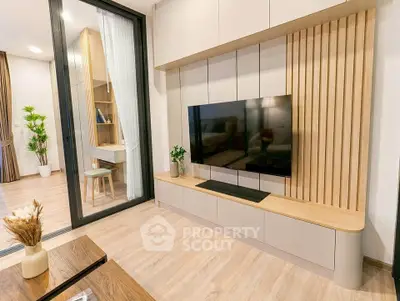 Modern living room with sleek TV unit and stylish decor in a contemporary apartment.