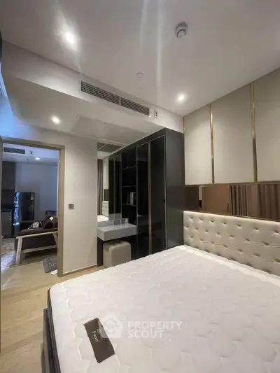 Luxurious bedroom with modern design and elegant furnishings in a high-end apartment.