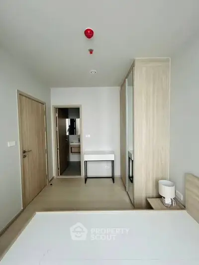 Modern bedroom with minimalist design and built-in wardrobe