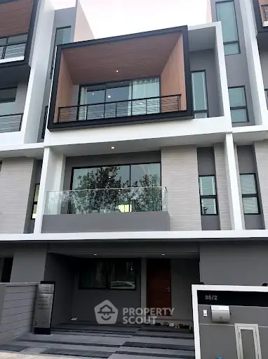 Modern multi-story townhouse with sleek design and spacious balconies