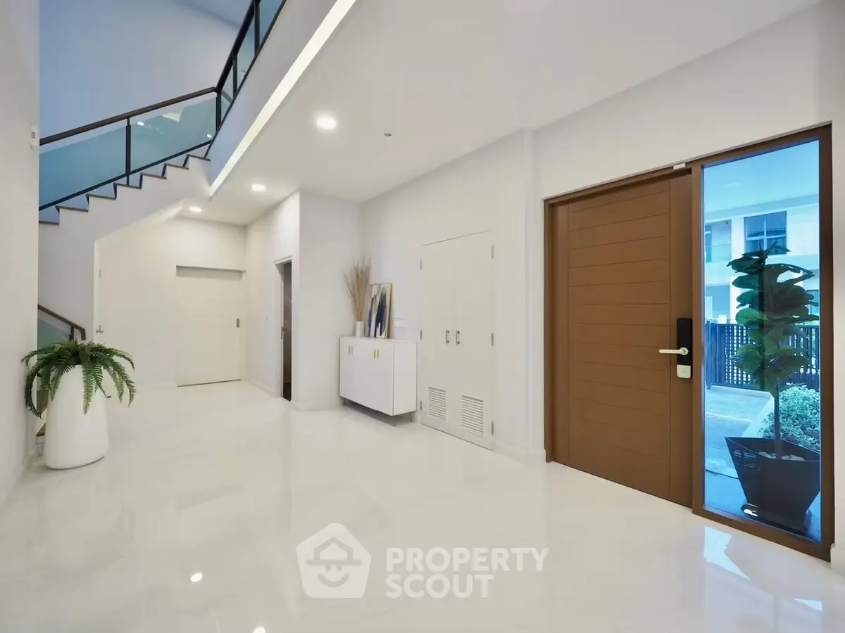 Spacious modern entrance with sleek design and natural light