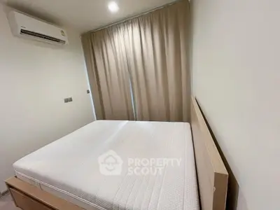Cozy minimalist bedroom with natural light and air conditioning
