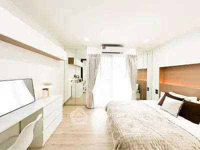 Modern bedroom with elegant decor and ample natural light