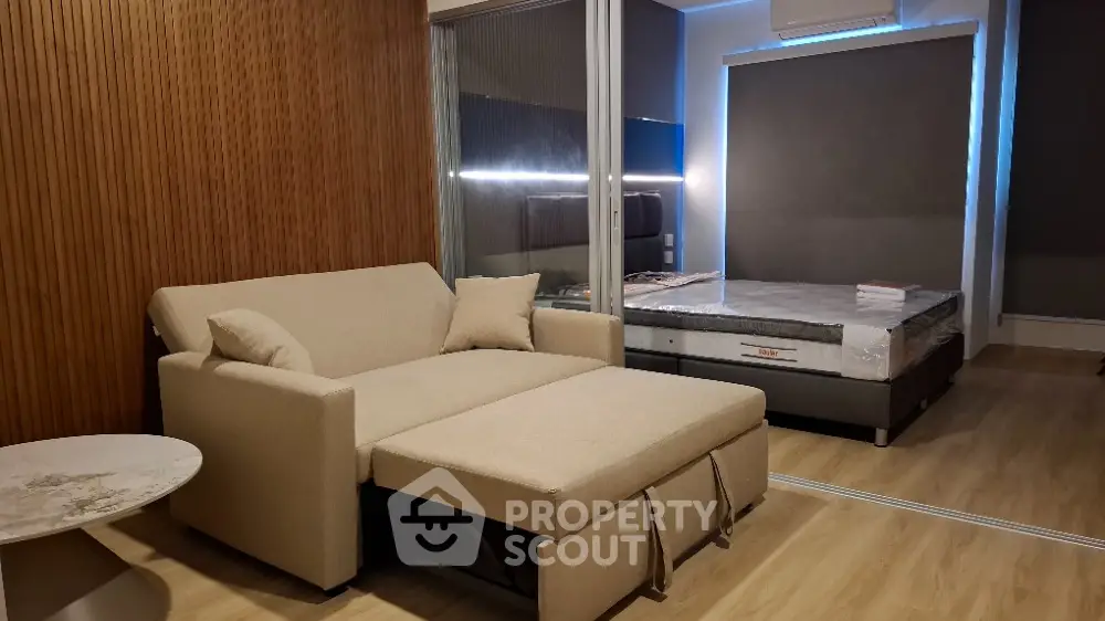 Modern bedroom with stylish sofa bed and elegant decor