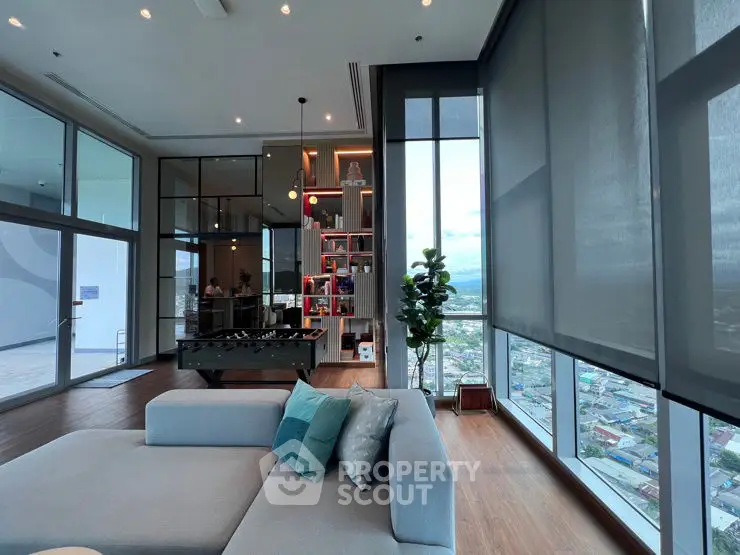 Spacious modern living room with panoramic city views and stylish decor