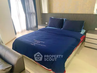 Spacious bedroom with modern decor and natural light