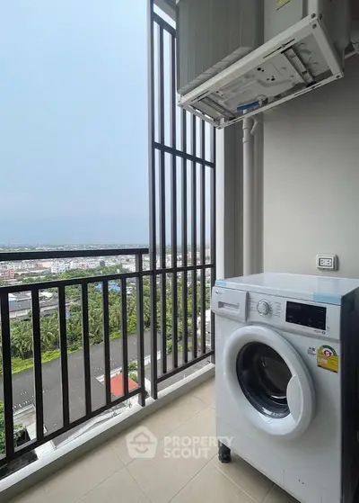 Modern balcony with washing machine and scenic city view, perfect for urban living convenience.