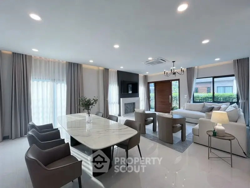 Luxurious modern living room with elegant dining area and natural light