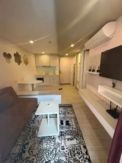 Modern living room with stylish decor and open kitchen layout