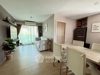 Spacious living room with modern decor and natural light