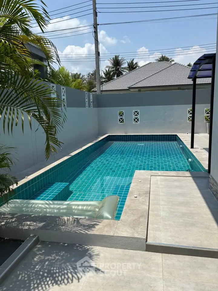 Stunning private pool with modern design in a serene residential area.