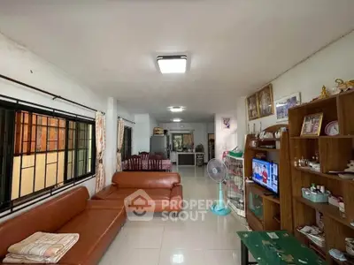 Spacious living room with modern furniture and open layout, perfect for family gatherings.