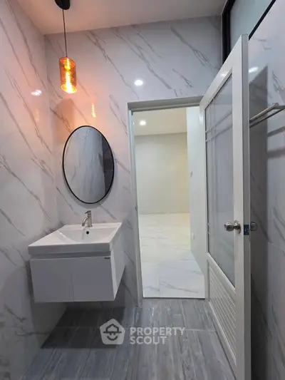Modern bathroom with sleek design and elegant lighting