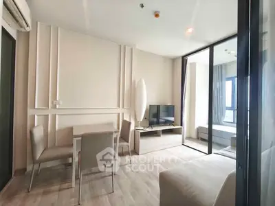 Modern living room with sleek furniture and natural light in a stylish apartment.