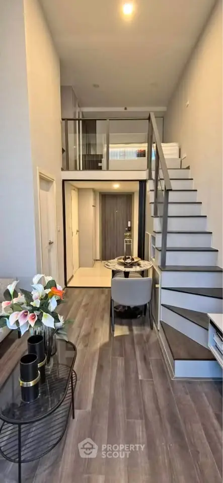 Modern duplex apartment with stylish staircase and elegant decor