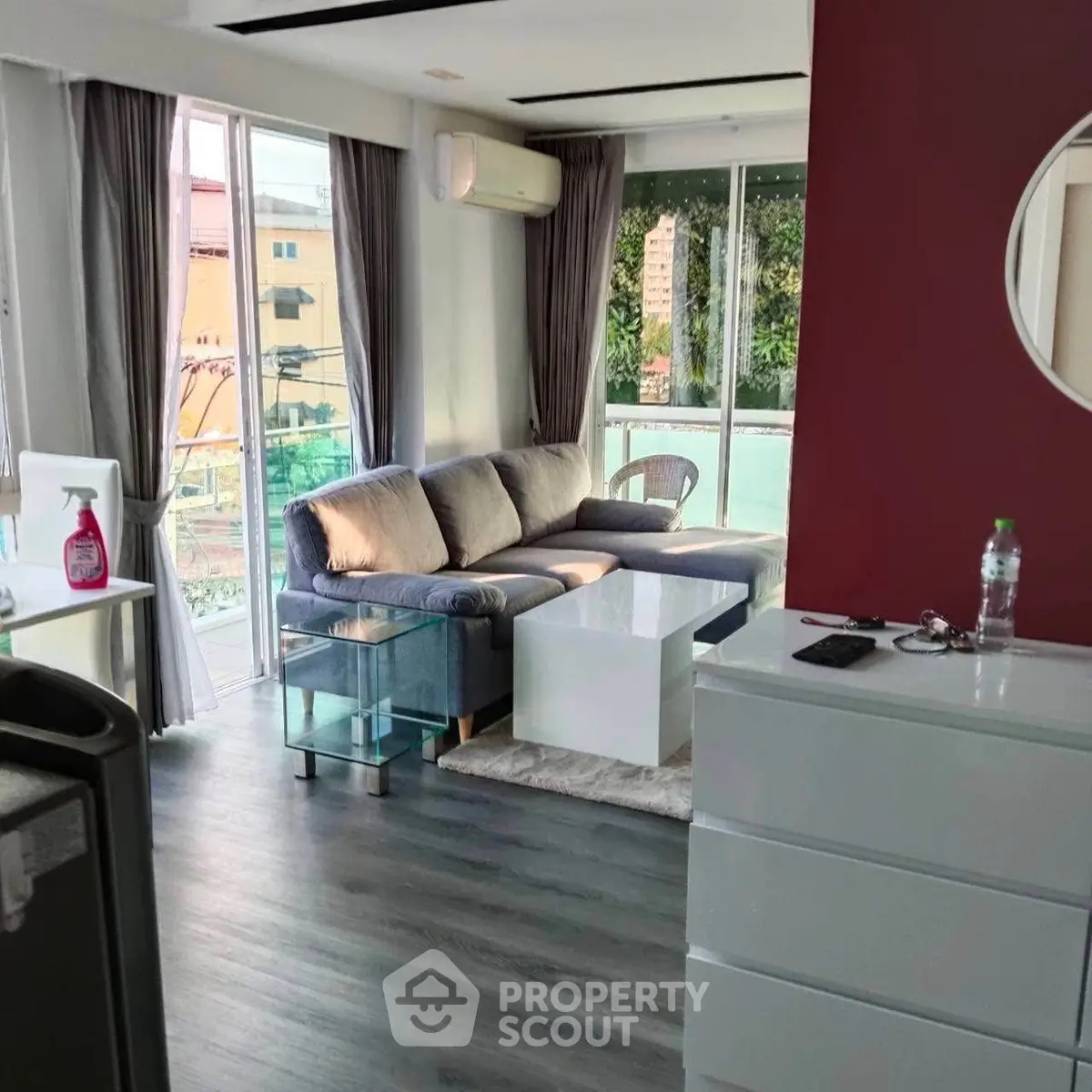 Modern living room with large windows and stylish furniture