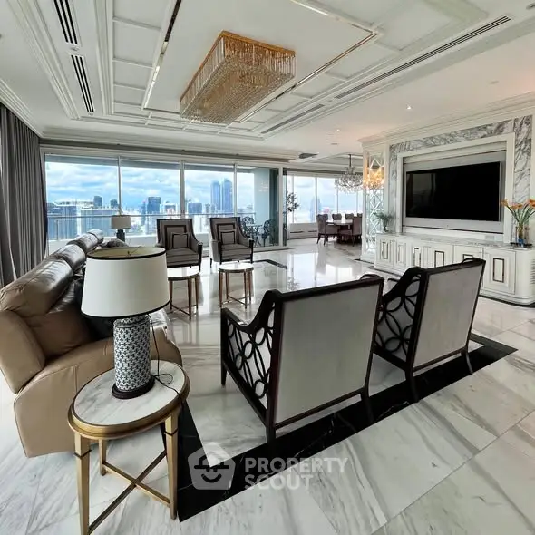 Luxurious open-plan living room with stunning city views and elegant decor.