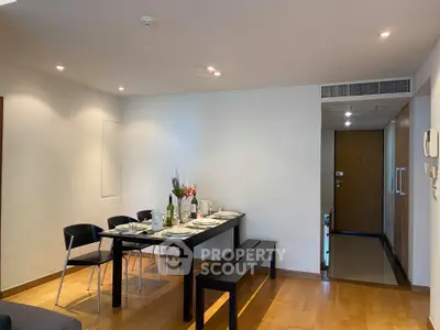 Modern dining area with elegant table setting in a cozy apartment