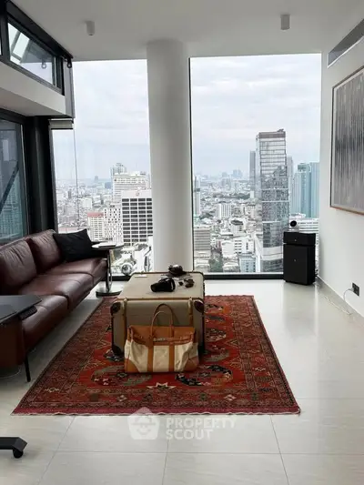 Luxurious high-rise living room with panoramic city views and modern decor.
