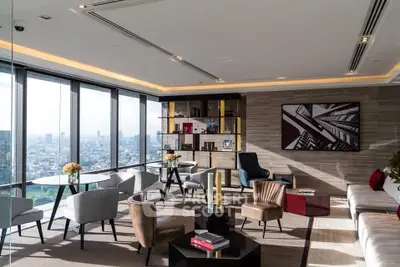 Luxurious modern living room with panoramic city views and stylish furniture.