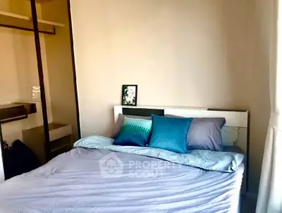 Cozy bedroom with modern decor and ample natural light