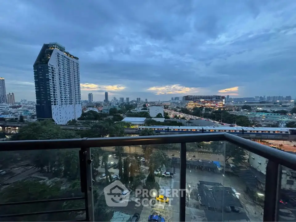 Stunning cityscape view from a high-rise balcony at dusk, showcasing urban skyline and vibrant city life.