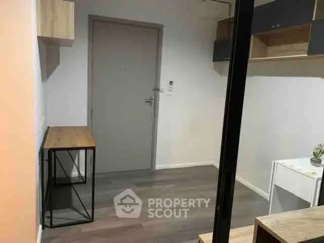 Compact modern study room with minimalist furniture and sleek design.