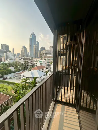 Stunning city view from a modern balcony in a high-rise apartment, perfect for urban living.