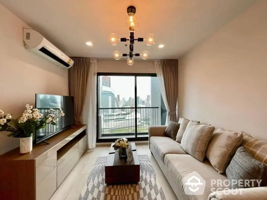 Chic modern living room with plush sofa, stylish light fixture, and a captivating city view through the balcony doors, perfect for urban living.