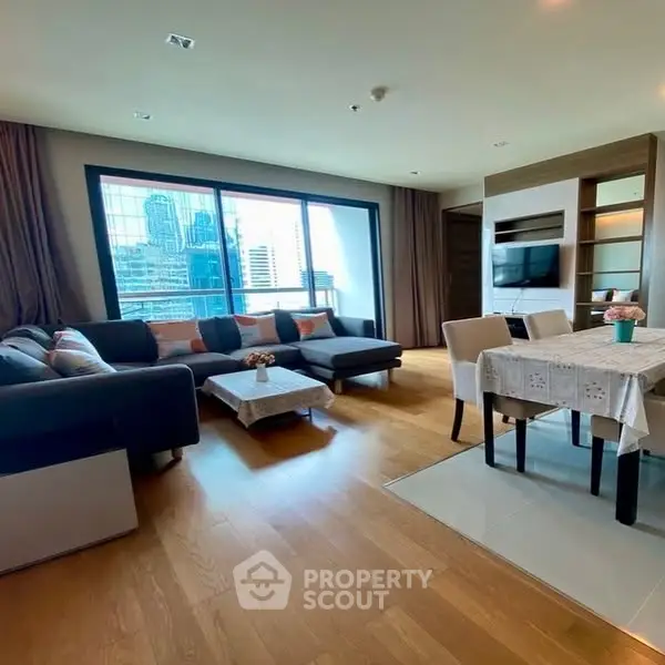 Spacious modern living room with city view and elegant dining area