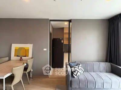 Modern living room with stylish furniture and open kitchen layout