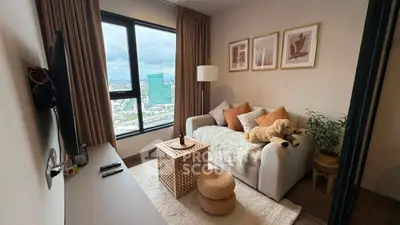 Cozy living room with city view, stylish decor, and comfortable seating in modern apartment.