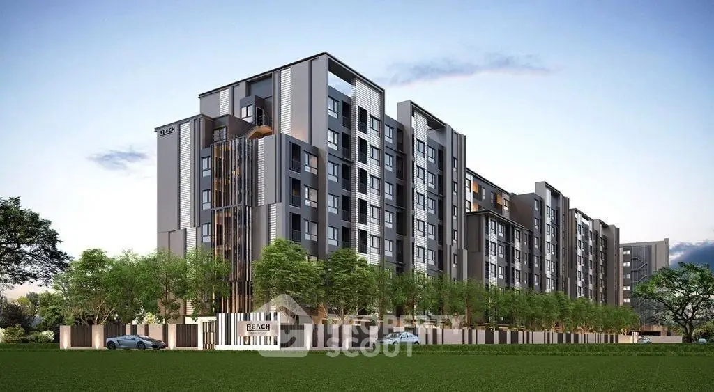 Modern apartment building exterior with lush greenery and sleek design.