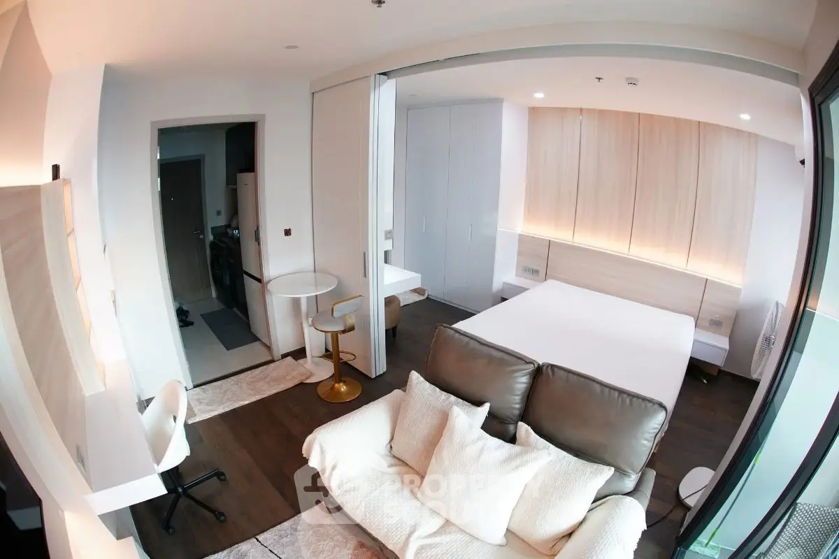 Modern studio apartment with cozy living area and stylish decor