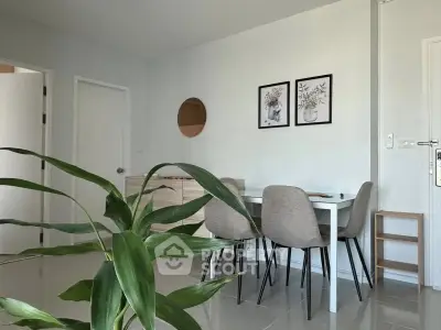 Modern dining area with stylish decor and natural light, perfect for cozy meals and gatherings.