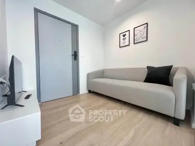 Modern minimalist living room with sleek sofa and wall art