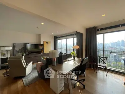 Spacious living room with city view, modern furniture, and natural light