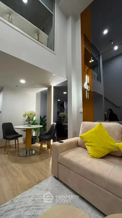 Modern duplex living room with stylish decor and cozy seating area