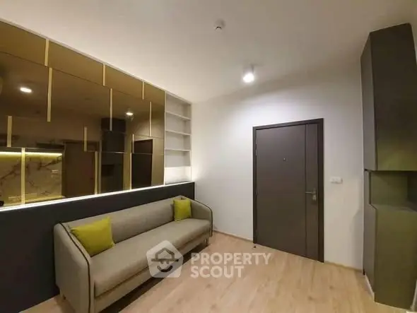 Modern living room with sleek design and cozy sofa, perfect for relaxation.