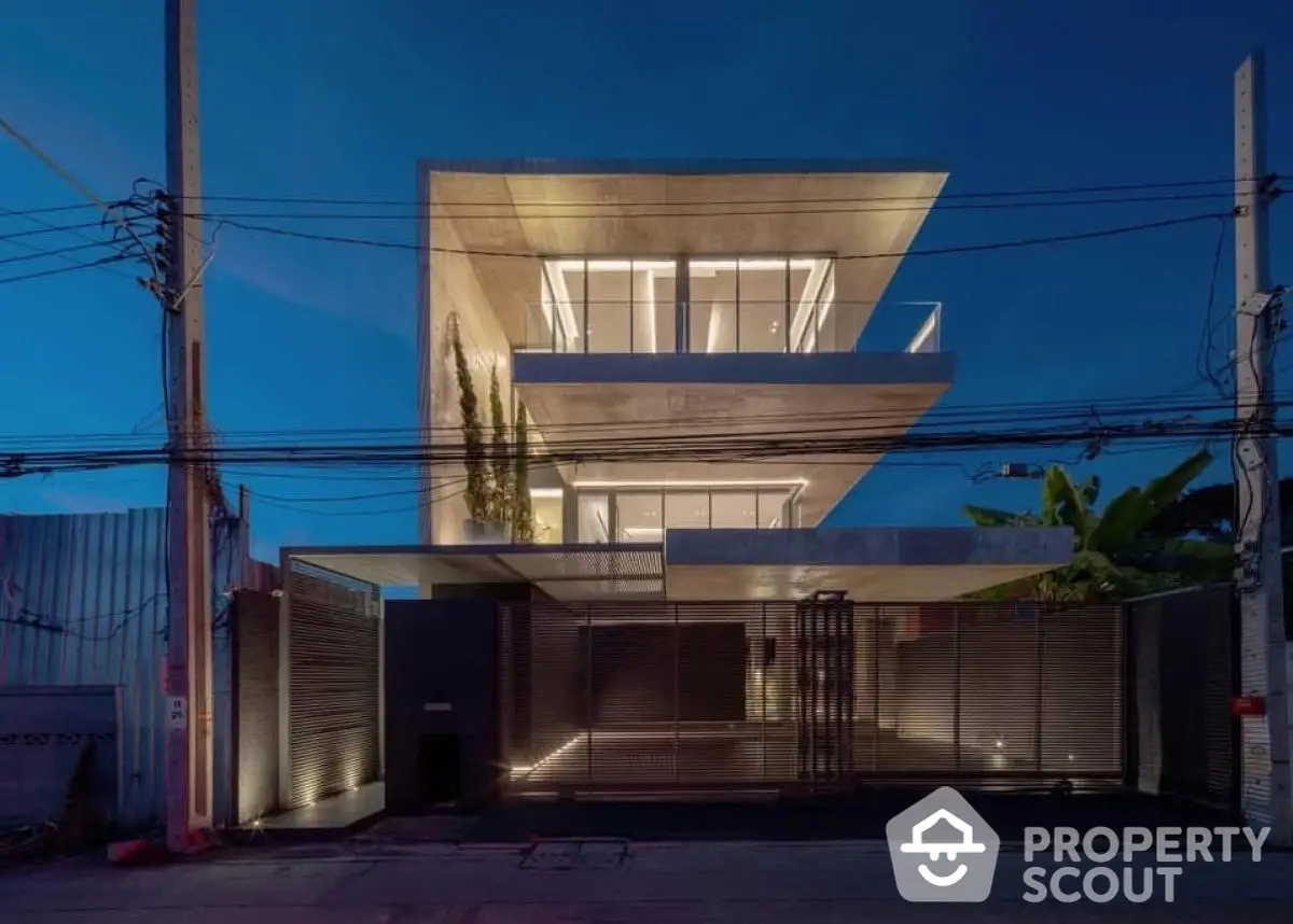 Modern architectural masterpiece with sleek lines and illuminated facade at dusk