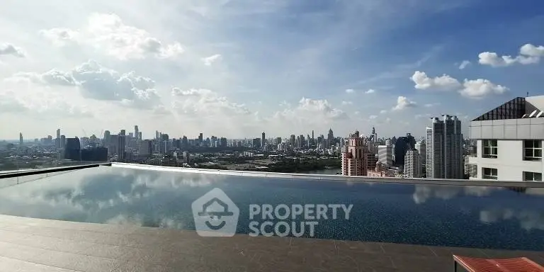 Stunning rooftop infinity pool with breathtaking city skyline view
