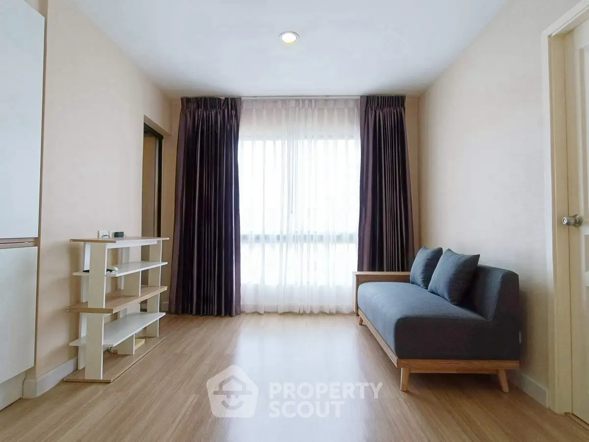 Spacious living room with modern sofa and natural light