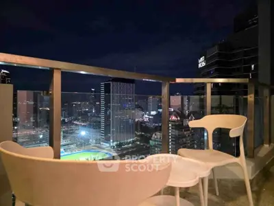 Stunning cityscape view from a modern balcony with sleek furniture, perfect for urban living.