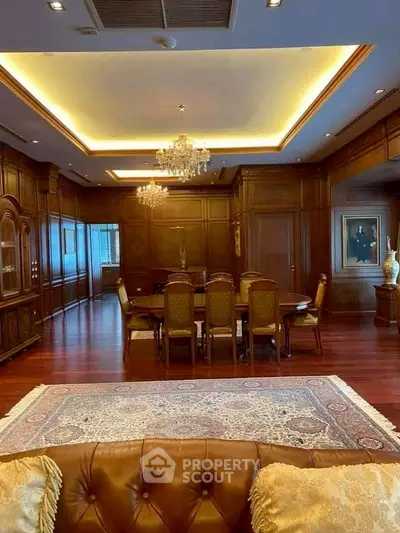 Luxurious dining room with elegant wood paneling and chandelier lighting
