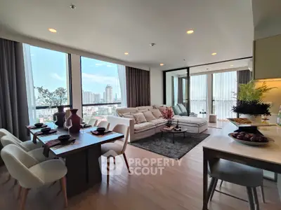 Luxurious living room with panoramic city view and elegant dining area