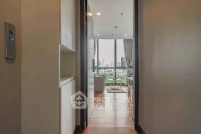 Spacious apartment entrance with stunning city view and modern interior design.