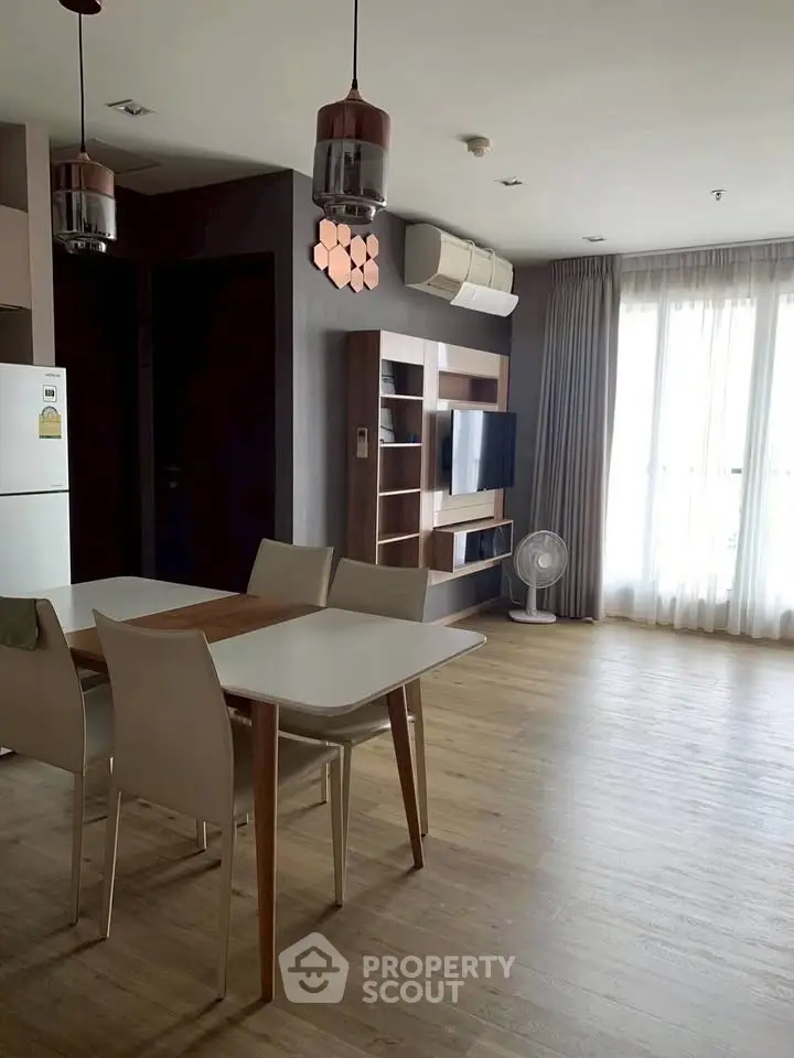 Modern living room with dining area and stylish lighting