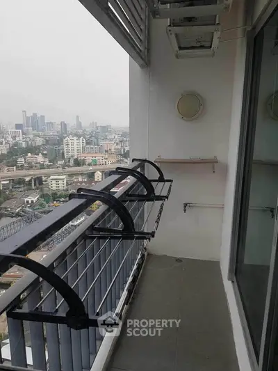 Spacious balcony with city view in modern apartment building