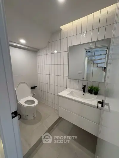 Modern bathroom with sleek fixtures and stylish tile design