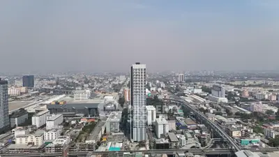 Stunning aerial view of modern cityscape with high-rise buildings and sprawling urban landscape.